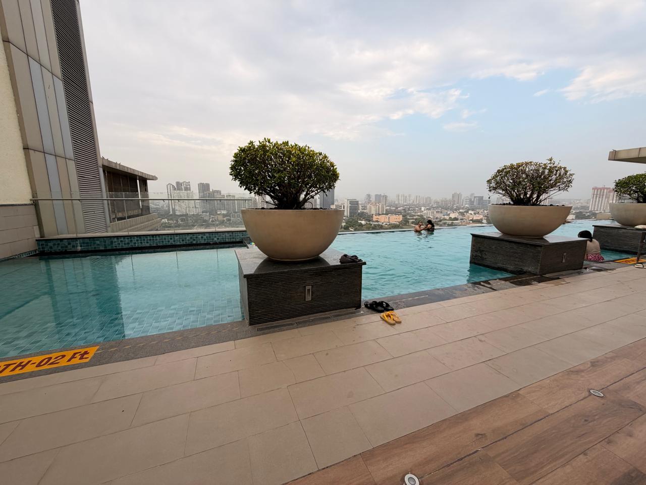 Rooftop infinity pool over the Gurgaon skyline at M3M Urbana, Sector 67