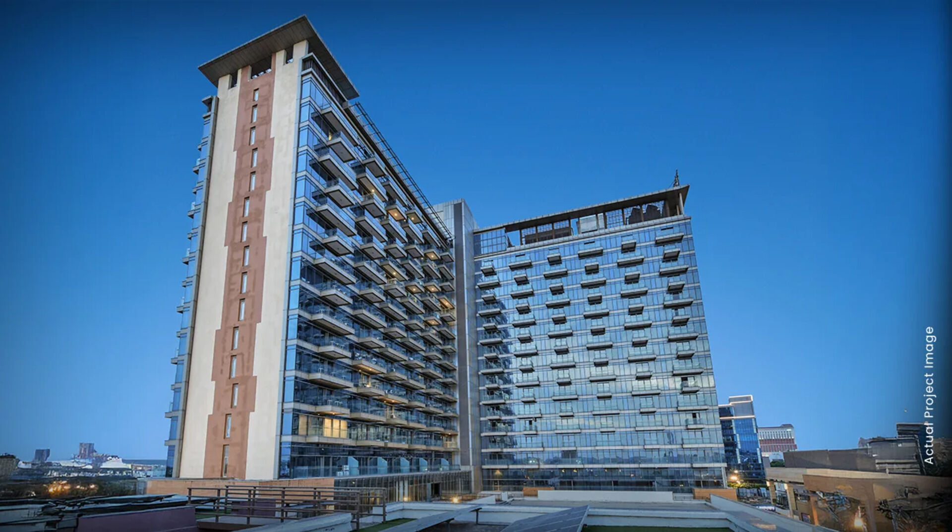M3M Urbana serviced apartments at dusk — Sector 67, Gurgaon